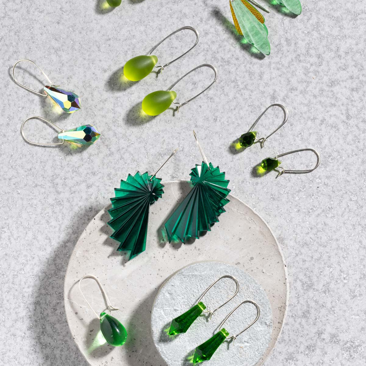 Flat lay of earrings from Betsy Blonde featuring green colours